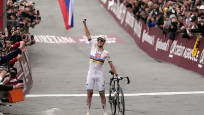 Tadej Pogacar of Team UAE Emirates celebrates winning the Strade Bianche (White Roads), a 203 km one day cycling race from and to Siena, Italy, Saturday March 7, 2026. (Fabio Ferrari/LaPresse via AP)