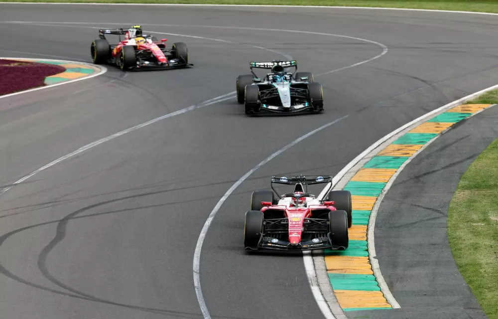 Formula One F1 - Australian Grand Prix - Albert Park Grand Prix Circuit, Melbourne, Australia - March 8, 2026 Ferrari's Charles Leclerc in action ahead of Mercedes' George Russell during the race REUTERS/Mark Peterson