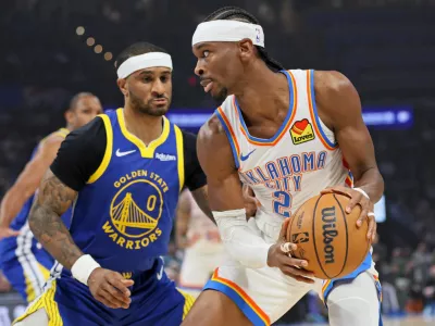 Oklahoma City Thunder guard Shai Gilgeous-Alexander (2) looks for an outlet against Golden State Warriors guard Gary Payton II (0) during the first half of an NBA basketball game Saturday, March 7, 2026, in Oklahoma City. (AP Photo/Nate Billings)