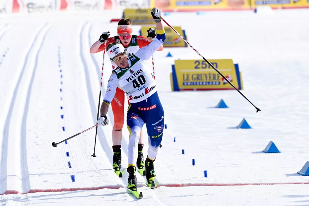 Frida Karlsson of Sweden crosses the finish line ahead of Nadja K&auml;lin of Switzerland to win the Cross-Country Skiing Women's 10 km Interval Start Classic Style competition at the FIS Nordic World Cup Lahti Ski Games in Lahti,, Finland, Sunday March 8, 2026. (Emmi Korhonen/Lehtikuva via AP)