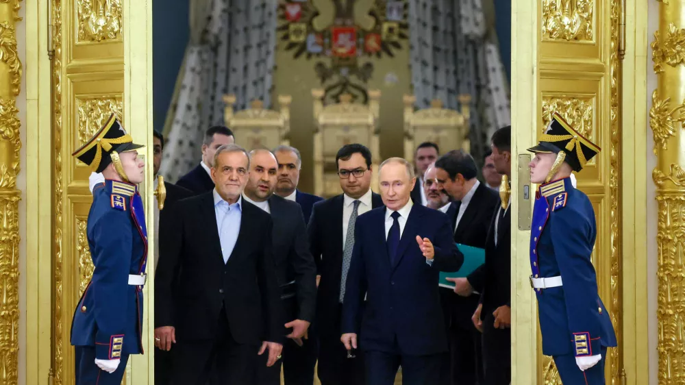FILE - Iranian President Masoud Pezeshkian, center left, and Russian President Vladimir Putin, center right, arrive at a ceremony following their talks at the Kremlin in Moscow, Russia, on Jan. 17, 2025. (Vyacheslav Prokofyev, Sputnik, Kremlin Pool Photo via AP, File)