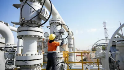 FILE PHOTO: A worker operates valves at the Rumaila oil field, as the country cuts nearly 1.5 million barrels per day of output amid halted exports following the closure of the Strait of Hormuz, in Basra, Iraq, March 4, 2026. REUTERS/Essam Al-Sudani/File Photo