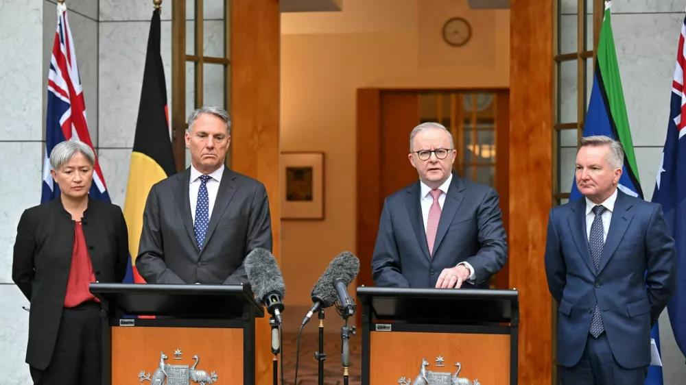Australia's Minister for Foreign Affairs Penny Wong, Deputy Prime Minister , PriRichard Marlesme Minister Anthony Albanese and Minister for Climate Change Chris Bowen attend a press conference at Parliament House in Canberra, Australia, March 10, 2026. AAP Image/Mick Tsikas/via REUTERS  ATTENTION EDITORS - THIS IMAGE WAS PROVIDED BY A THIRD PARTY. NO RESALES. NO ARCHIVE. AUSTRALIA OUT. NEW ZEALAND OUT. NO COMMERCIAL OR EDITORIAL SALES IN NEW ZEALAND. NO COMMERCIAL OR EDITORIAL SALES IN AUSTRALIA.