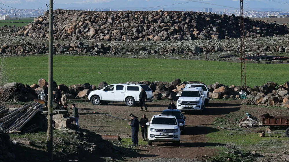 Turkish army and security personnel search a field after a piece of ammunition fell following the interception of a missile launched from Iran by a NATO air‑defence system, in Diyarbakir, Turkey, March 9, 2026. REUTERS/Sertac Kayar