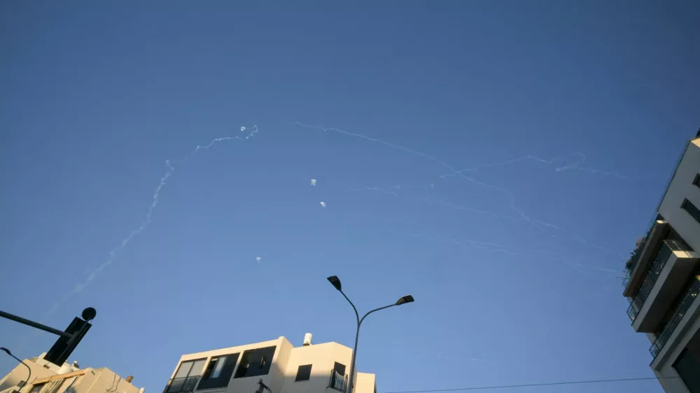 Vapour trails in the sky after Israel intercepted projectiles launched from Lebanon, amid an escalation between Hezbollah and Israel, and amid the U.S.-Israeli conflict with Iran, as seen from Tel Aviv, Israel March 9, 2026. REUTERS/Dylan Martinez