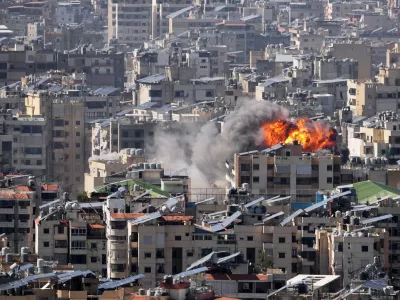 Smoke and flames rise from an Israeli airstrike in Dahiyeh, Beirut's southern suburbs, Wednesday, March 11, 2026. (AP Photo/Hassan Ammar)