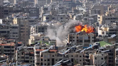 Smoke and flames rise from an Israeli airstrike in Dahiyeh, Beirut's southern suburbs, Wednesday, March 11, 2026. (AP Photo/Hassan Ammar)
