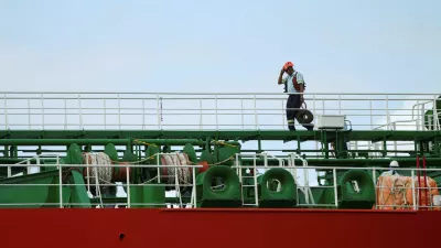 A crew member walks on the deck of the Marshall Islands-flagged oil tanker Atlantic Rainbow as it transits the Panama Canal, after the interoceanic waterway reported a 2.8% increase in vessel transits in the first four months of its fiscal year through January, according to the canal authority, in Panama City, Panama, March 11, 2026. REUTERS/Enea Lebrun