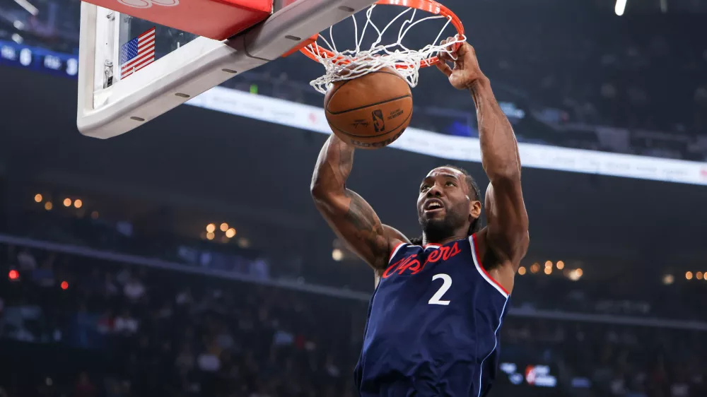 Los Angeles Clippers forward Kawhi Leonard (2) dunks during the first half of an NBA basketball game against the Minnesota Timberwolves, Wednesday, March 11, 2026, in Inglewood, Calif. (AP Photo/Jessie Alcheh)