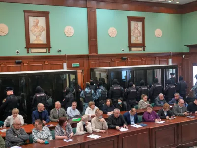 Men tried on the charges of involvement in a terror attack at the Crocus City Hall in March 2024 listen to the verdict in a glass cage at the Moscow City Court in Moscow, Russia, Thursday, March 12, 2026. (AP Photo/Pavel Bednyakov)