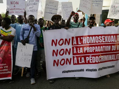 FILE PHOTO: SENSITIVE MATERIAL. THIS IMAGE MAY OFFEND OR DISTURB. Anti‑LGBT supporters march through the streets during a protest calling for tougher action after authorities detained people for what police said were crimes including same‑sex intercourse and intentional HIV transmission, and about a dozen others in what police said was a child‑abuse network, in Dakar, Senegal, February 14, 2026. REUTERS/Zohra Bensemra/File Photo
