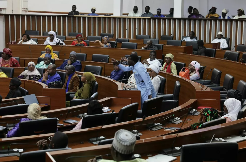 El Hadj Ababacar Tambedou speaks in the parliament during a debate on a new bill that would double the maximum penalty for same-sex sexual acts to 10 years and criminalize the promotion of homosexuality, in Dakar, Senegal, March 11, 2026. REUTERS/Zohra Bensemra