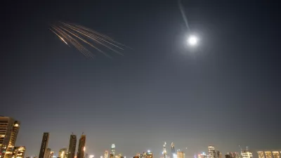 Missiles launched from Iran streak across the sky over central Israel, Thursday, March 5, 2026. (AP Photo/Ohad Zwigenberg)