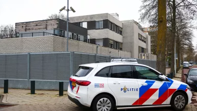 A police vehicle outside a Jewish school following an explosion that caused minor damages, in Amsterdam, Netherlands, March 14, 2026. REUTERS/Piroschka van de Wouw