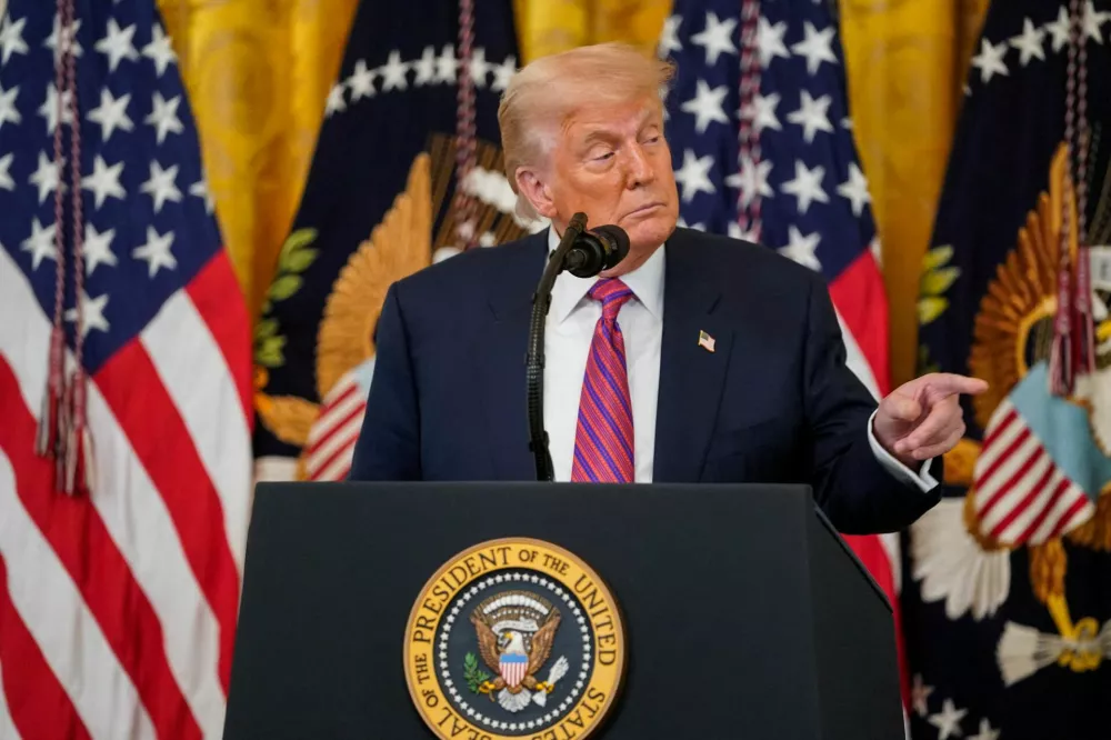 FILE PHOTO: U.S. President Donald Trump speaks before signing the "Genius Act", which will develop regulatory framework for stablecoin cryptocurrencies and expand oversight of the industry, at the White House in Washington, D.C., U.S., July 18, 2025. REUTERS/Nathan Howard/File Photo
