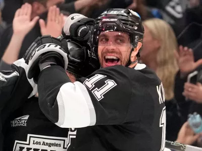 Los Angeles Kings defenseman Mikey Anderson, left, celebrates his goal with center Anze Kopitar during the second period of an NHL hockey game against the New York Islanders, Thursday, March 5, 2026, in Los Angeles. (AP Photo/Mark J. Terrill)
