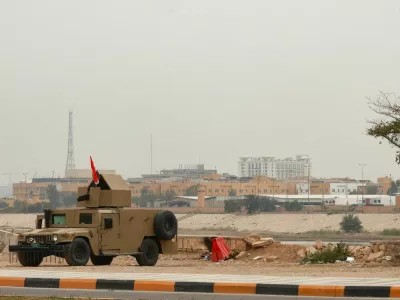 An Iraqi army Humvee stands guard near the U.S. Embassy, after Iraqi security sources said the embassy was hit in a missile attack, in Baghdad, Iraq, March 14, 2026. REUTERS/Ahmed Saad