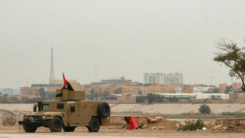 An Iraqi army Humvee stands guard near the U.S. Embassy, after Iraqi security sources said the embassy was hit in a missile attack, in Baghdad, Iraq, March 14, 2026. REUTERS/Ahmed Saad