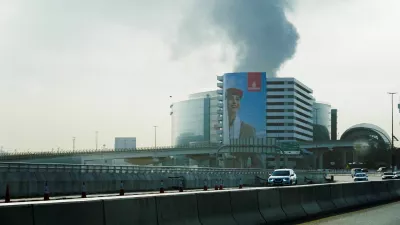 Smoke rising from the Dubai International Airport is seen through the windshield of a vehicle, after a drone attack hit a fuel tank, according to Dubai authorities, amid the U.S.-Israel conflict with Iran, in Dubai, United Arab Emirates, March 16, 2026, REUTERS/Stringer REFILE - QUALITY REPEAT