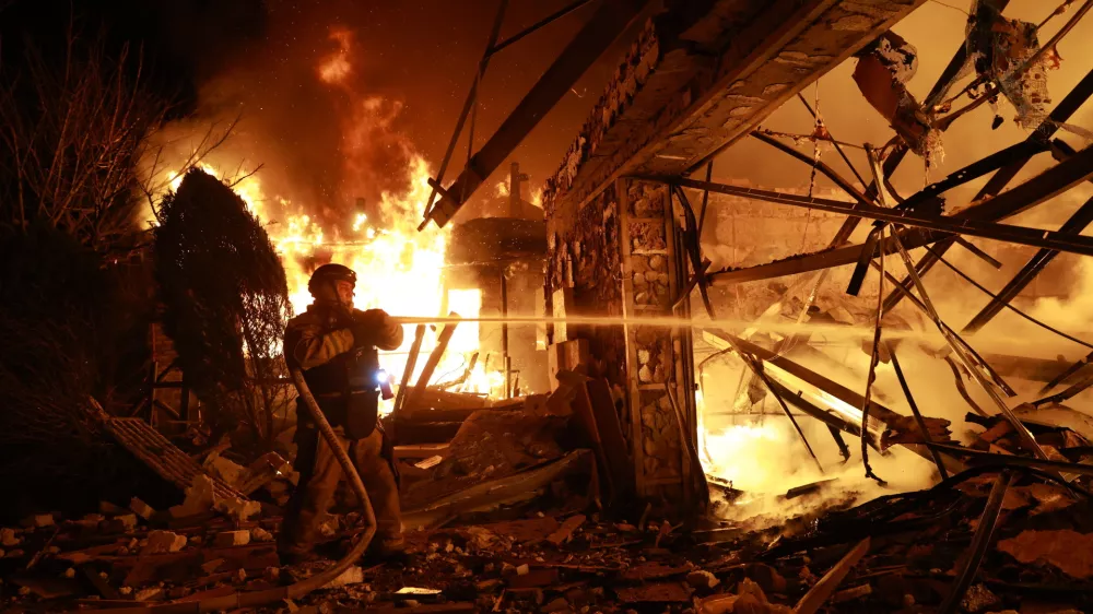 Firefighters try to put out a fire at a private house following a Russian drone attack in Zaporizhzhia, Ukraine, Monday, March 16, 2026. (AP Photo/Kateryna Klochko)