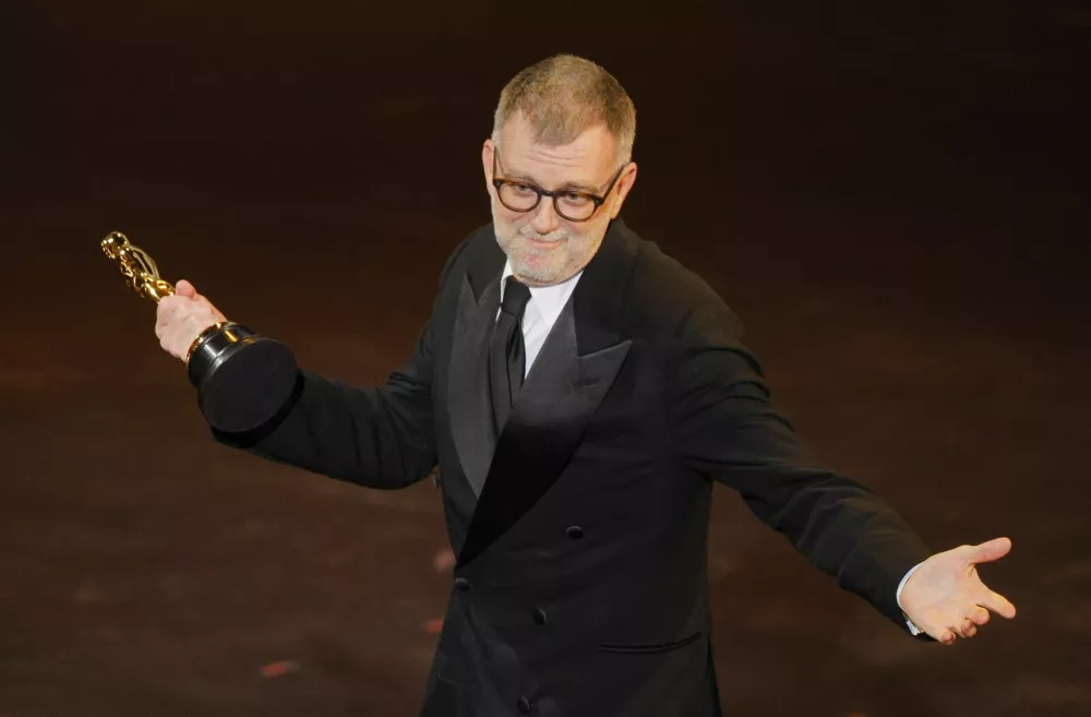 Paul Thomas Anderson wins the Oscar for Best Adapted Screenplay for "One Battle after Another" during the Oscars show at the 98th Academy Awards in Hollywood, Los Angeles, California, U.S., March 15, 2026. REUTERS/Mike Blake