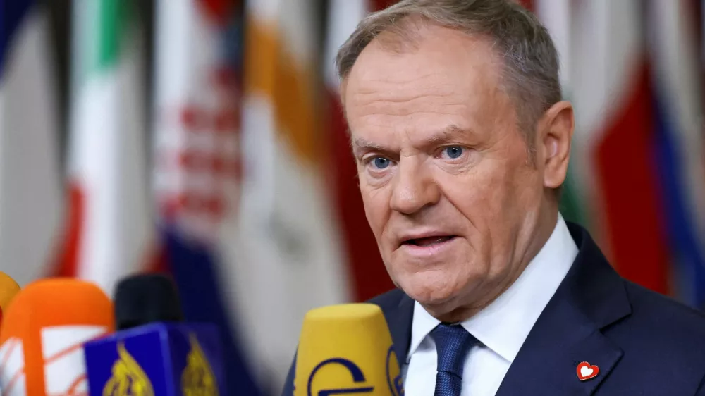 FILE PHOTO: Polish Prime Minister Donald Tusk speaks to the media at a European Union leaders' summit in Brussels, Belgium, December 18, 2025. REUTERS/Yves Herman/File Photo