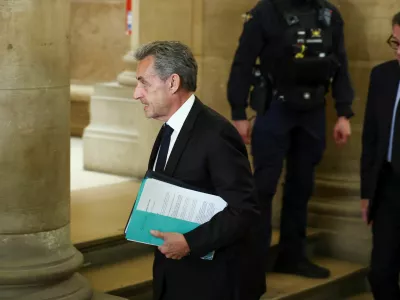 Former French President Nicolas Sarkozy arrives for the opening of the appeal in the case over Libyan campaign financing, for which he was briefly jailed last year, at Paris appeal court, France, March 16, 2026. REUTERS/Gonzalo Fuentes