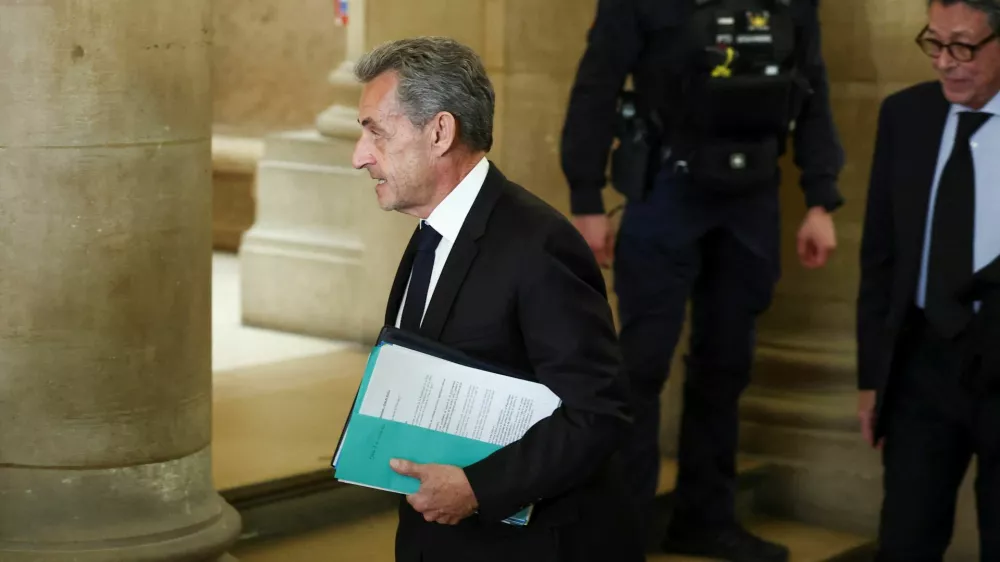 Former French President Nicolas Sarkozy arrives for the opening of the appeal in the case over Libyan campaign financing, for which he was briefly jailed last year, at Paris appeal court, France, March 16, 2026. REUTERS/Gonzalo Fuentes