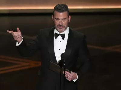 Jimmy Kimmel presents the award for best documentary short film during the Oscars on Sunday, March 15, 2026, at the Dolby Theatre in Los Angeles. (AP Photo/Chris Pizzello)
