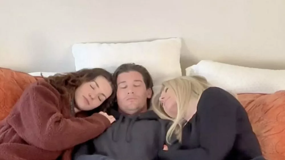 EXCLUSIVE: Story from Jam Press (Throuple Share Bed)'We take turns rotating spots in,200 king size bed but people keep asking us ONE question about sex life as a throuple'A throuple who share a,200 (Ł1,031) king-size bed have revealed the one thing they're always asked about their sex life.Megan, 39, Alana, 29, and Kevin, 35, claim they're constantly asked about the sleeping arrangements in their relationship.Rather than claiming a permanent side of the mattress, the trio switch positions every night to keep things equal."It works perfectly," Megan, from Colorado, USA, told What's the Jam."Intimacy is pretty equal."We all love physical touch, so there's a lot of cuddling and closeness across the board."People always ask about the sleeping arrangements."It's definitely one of the top questions people are curious about."We usually go to bed around the same time, so we're all in the bathroom getting ready together and then pile into bed."Alana likes things very quiet, so we agreed on a really low TV volume if it's on while we're falling asleep."They sleep in a king-size bed that costs around Ł1,031 - and even turned the mattress sideways to create a bit more room for three bodies.When travelling, things can get trickier for Megan, who works in operations, Alana, who works in marketing and Kevin, who works in production.Megan said: "Things can be a little complicated."When you book a room for three people, hotels almost always give you two beds because they assume no one wants to share."We usually request a king when we get there, and if it has to be two beds, we just rotate who sleeps where each night."The throuple say the biggest misconception about their bedroom dynamic is that it's constantly wild.Megan said: "The biggest misconception is that it's chaotic or sexual all the time."In reality, it's just three people sharing space, routines, comfort, and sleep like any other relationship, just.05 Mar 2026Pictured: Story from Jam Press (Throuple Share Bed)Pictured: Video grab: Kevin, Alana and Megan in bed.'We take turns rotating spots in,200 king size bed but people keep asking us ONE question about sex life as a throuple'A throuple who share a,200 (Ł1,031) king-size bed have revealed the one thing they're always asked about their sex life.Megan, 39, Alana, 29, and Kevin, 35, claim they're constantly asked about the sleeping arrangements in their relationship.Rather than claiming a permanent side of the mattress, the trio switch positions every night to keep things equal."It works perfectly," Megan, from Colorado, USA, told What's the Jam."Intimacy is pretty equal."We all love physical touch, so there's a lot of cuddling and closeness across the board."People always ask about the sleeping arrangements."It's definitely one of the top questions people are curious about."We usually go to bed around the same time, so we're all in the bathroom getting ready together and then p.,Image: 1080293660, License: Rights-managed, Restrictions: NO Australia, Germany, Norway, South Korea, Sweden, United Kingdom, United States, Unknown Country, Model Release: no, Pictured: Video grab: Kevin, Alana and Megan