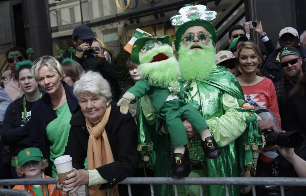 Dennis O'Mally, the self proclaimed "King of the Leprechaun" cheers on marchers as they make their way up 5th Ave. during the 251st annual St. Patrick's Day Parade, Saturday, March 17, 2012 in New York. (AP Photo/Mary Altaffer)