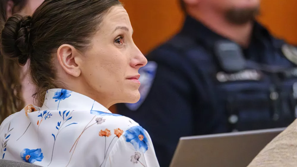 Defendant Kouri Richins, left, accused of poisoning her husband in March 2022, listens to closing arguments in Third District Court, Monday, March 16, 2026, in Park City, Utah. (David Jackson/Pool Photo via AP)