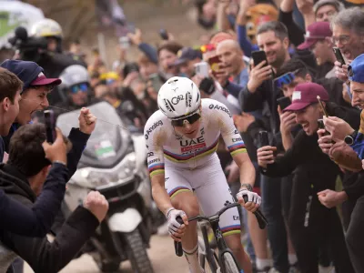 Tadej Pogacar of Team UAE Emirates pedals during the Strade Bianche (White Roads), a 203 km one day cycling race from and to Siena, Italy, Saturday March 7, 2026. (Fabio Ferrari/LaPresse via AP)