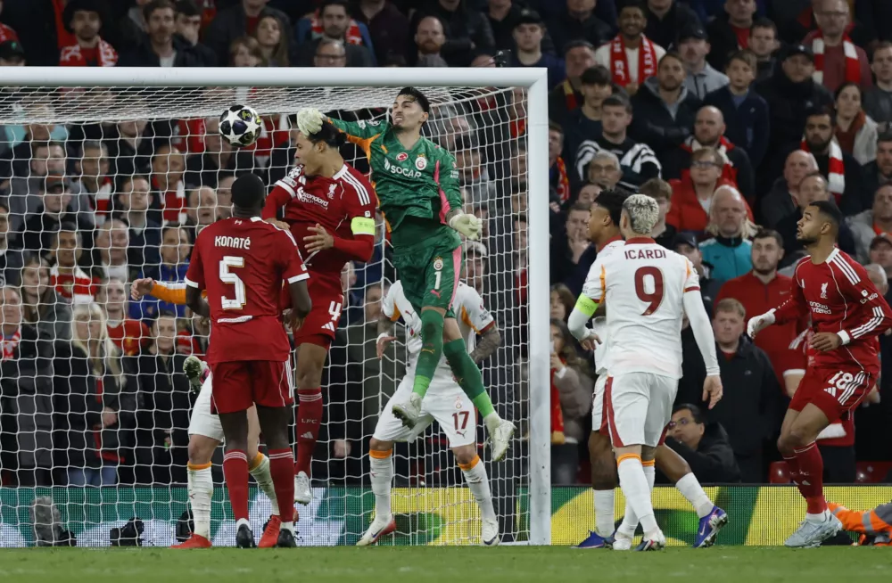 Soccer Football - UEFA Champions League - Round 16 - Second Leg - Liverpool v Galatasaray - Anfield, Liverpool, Britain - March 18, 2026 Liverpool's Virgil van Dijk in action with Galatasaray's Ugurcan Cakir Action Images via Reuters/Jason Cairnduff