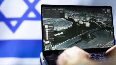 Mossad agent using laptop device, operating anti ballistic system designed to counter missiles threatening country. Close up shot of Israeli counterintelligence officer defending against rockets / Foto: Dragos Condrea
