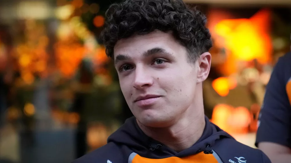McLaren driver Lando Norris of Britain talks to the media at the Lusail International Circuit ahead of the Qatar Formula One Grand Prix, in Lusail, Qatar, Thursday, Nov. 27, 2025. (AP Photo/Darko Bandic)
