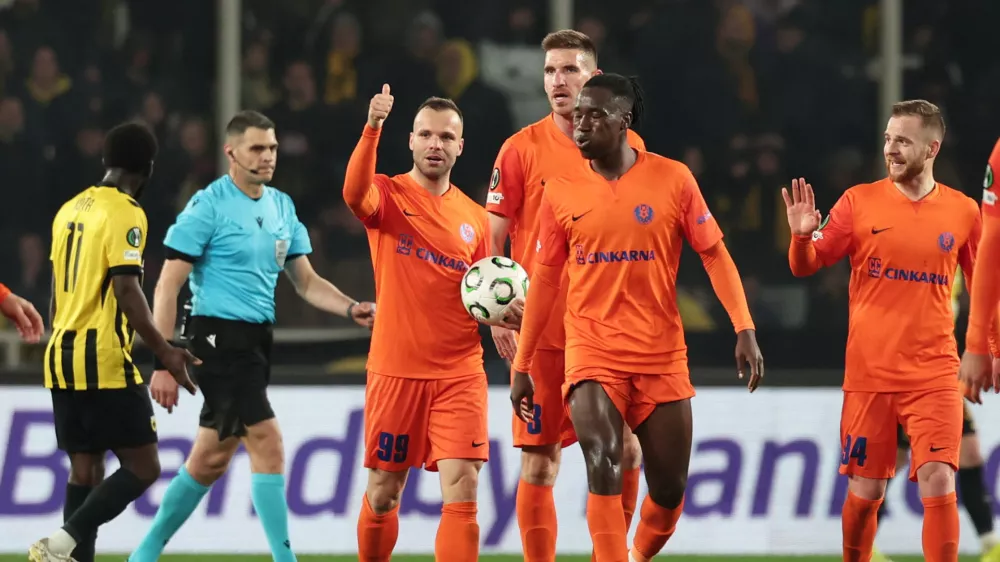 Soccer Football - UEFA Conference League - Round of 16 - Second Leg - AEK Athens v Celje - AEK Arena, Athens, Greece - March 19, 2026 Celje's Rudi Pozeg Vancas celebrates scoring their second goal with teammates REUTERS/Alkis Konstantinidis