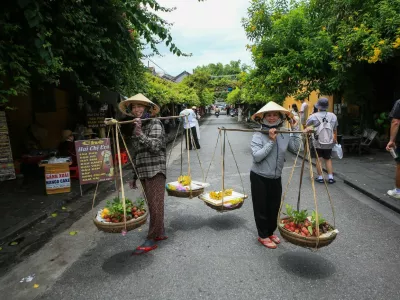 HOI AN, VIETNAM - JULY 11: A view of the city as daily life continues in ancient Town of Hoi An, which was one of Southeast Asia's most important trading ports from the 15th to the 19th century, in Vietnam on July 11, 2025. Located on the banks of the Thu Bon River, the town was inscribed on the UNESCO World Heritage List in 1999. The loss of the port's function in the 19th century played a key role in preserving Hoi An's narrow streets, traditional wooden buildings, and unique urban fabric to the present day. Bearing traces of Chinese, Japanese, and European cultures, the town features more than a thousand wooden-framed structures, temples, shops, and inns lining its narrow streets. According to UNESCO, Hoi An is considered one of the best-preserved ancient port settlements in Asia. UmmU Nisan Kandilcioglu / Anadolu/ABACAPRESS.COM,Image: 1029367048, License: Rights-managed, Restrictions:, Model Release: no