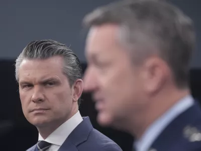 Defense Secretary Pete Hegseth and Chairman of the Joint Chiefs of Staff Gen. Dan Caine speak to members of the media during a press briefing at the Pentagon in Washington, Thursday, March 19, 2026. (AP Photo/Manuel Balce Ceneta)