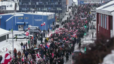 FILE - A crowd walks to the U.S. Consulate to protest against President Trump's policy towards Greenland, Saturday, Jan. 17, 2026, in Nuuk, Greenland. (AP Photo/Evgeniy Maloletka, File)