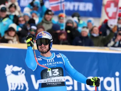 Italy's Dominik Paris celebrates at the finish area of an alpine ski, men's super-G race, at the Lillehammer World Cup Finals, in Kvitfjell, Norway, Sunday, March 22, 2026. (AP Photo/Marco Trovati)