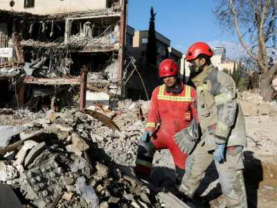 Members of a Red Crescent rescue team work at a building that was damaged by a strike, amid the U.S.-Israeli conflict with Iran, in Tehran, Iran, March 21, 2026. Reuters/Alaa Al-Marjani