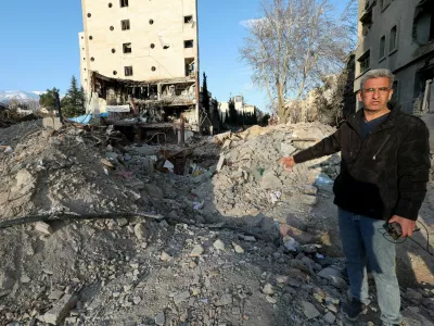Khalil Mirzahosseini, whose brother Mahdi is missing, gestures during an interview with Reuters at the site of a destroyed building that was damaged by a strike, amid the U.S.-Israeli conflict with Iran, in Tehran, Iran, March 21, 2026. Reuters/Alaa Al-Marjani
