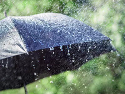 Rain on umbrella background, weather forecast and environmental concept