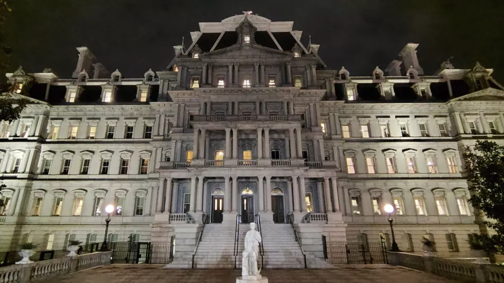 This photo provided by Will Hemsley shows a statue of Christopher Columbus standing in front of the Eisenhower Executive Office Building in Washington, Sunday, March 22, 2026. (Will Hemsley via AP)