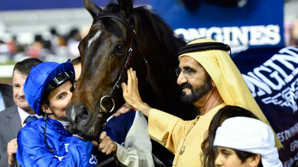 UAE Prime Minister and Ruler of Dubai Sheikh Mohammed bin Rashid al-Maktoum (C-R) celebrates with Jockey William Buick (C-L) and horse Jach Hobbs (C) after they won the Longines Dubai Sheema Classic at the Dubai World Cup in the Meydan Racecourse on March 25, 2017 in Dubai.,Image: 326506736, License: Rights-managed, Restrictions:, Model Release: no
