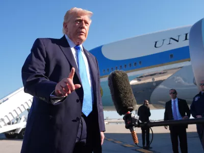 President Donald Trump speaks with the media before boarding Air Force One, Monday, March 23, 2026, at Palm Beach International Airport in West Palm Beach, Fla. (AP Photo/Mark Schiefelbein)