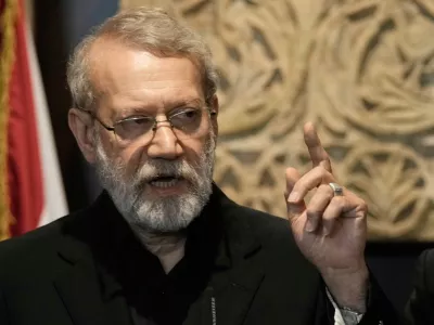 FILE -Iranian Secretary of Supreme National Security Council Ali Larijani, speaks during a press conference after his meeting with the Lebanese parliament speaker Nabih Berri, in Beirut, Lebanon, Aug. 13, 2025. (AP Photo/Bilal Hussein, File)