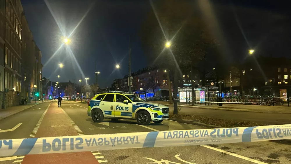 A Swedish police car stands near the site where a bus hit a bus stop in central Stockholm, Sweden, November 14, 2025. REUTERS/Marie Mannes