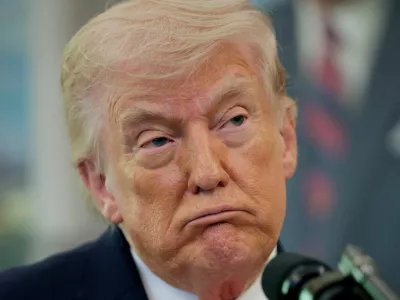 U.S. President Donald Trump looks on as he attends Markwayne Mullin's swearing-in as Department of Homeland Security (DHS) Secretary, at the White House in Washington, D.C., U.S., March 24, 2026. REUTERS/Evan Vucci